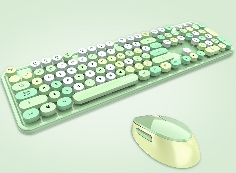 Pastel-green keyboard with round keys and a matching wireless mouse on a pale mint background.