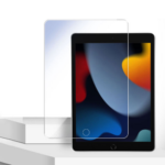 Tablet with a clear screen protector being placed over the screen on a white desk